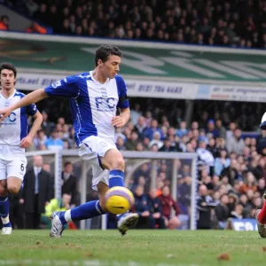 Theo Walcott shoots past Maik Taylor to score the 2nd Arsenal goal