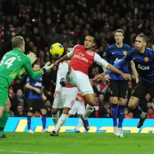 Theo Walcott vs. Anders Lindegaard: Intense Battle at the Emirates - Arsenal vs. Manchester United, Premier League 2011-12 Theo Walcott vs. Anders Lindegaard: Intense Battle at the Emirates - Arsenal vs. Manchester United, Premier League 2011-12