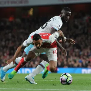 Theo Walcott vs. Arthur Masuaku: Intense Battle at the Emirates Stadium - Arsenal v West Ham United, Premier League Theo Walcott vs. Arthur Masuaku: Intense Battle at the Emirates Stadium - Arsenal v West Ham United, Premier League