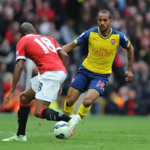 Theo Walcott vs Ashley Young: A Riveting Clash at Old Trafford - Manchester United vs Arsenal, Premier League 2014-15 Theo Walcott vs Ashley Young: A Riveting Clash at Old Trafford - Manchester United vs Arsenal, Premier League 2014-15