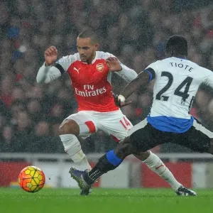 Theo Walcott vs. Cheick Tiote: A Fierce Battle in the Arsenal v Newcastle United Premier League Clash