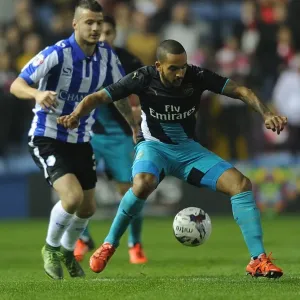Theo Walcott vs Daniel Pudil: A Football Rivalry in the Capital One Cup - Sheffield Wednesday vs Arsenal