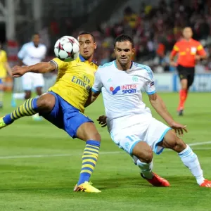 Theo Walcott vs. Jeremy Morel: A Tense Moment in the Marseille vs. Arsenal UEFA Champions League Clash Theo Walcott vs. Jeremy Morel: A Tense Moment in the Marseille vs. Arsenal UEFA Champions League Clash