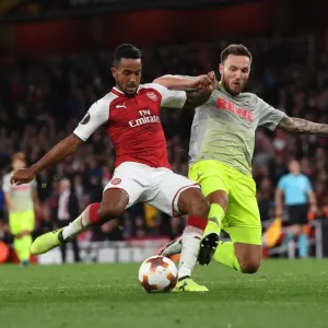 Theo Walcott vs Jorge Mere: Intense Moment in Arsenal v FC Köln UEFA Europa League Clash