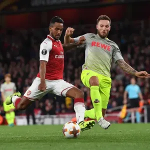 Theo Walcott vs Jorge Mere: A Tense Shooting Showdown in Arsenal FC vs 1. FC Koeln UEFA Europa League Match