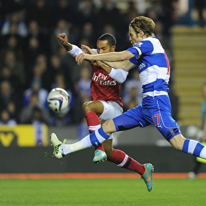 Theo Walcott vs Kaspars Gorkss: Intense Battle in Reading v Arsenal Capital One Cup Clash