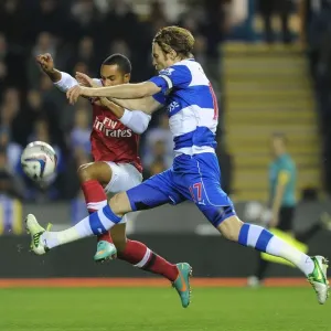 Theo Walcott vs Kaspars Gorkss: Intense Battle in Reading v Arsenal Capital One Cup Clash