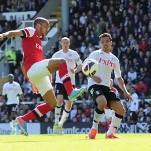 Theo Walcott vs. Kieran Richardson: Intense Battle at Craven Cottage during Arsenal's Premier League Victory Theo Walcott vs. Kieran Richardson: Intense Battle at Craven Cottage during Arsenal's Premier League Victory