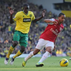 Theo Walcott vs. Leon Barnett: A Premier League Battle at Carrow Road, November 2011