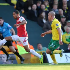 Theo Walcott vs Marc Tierney: A Premier League Battle at Carrow Road, November 2011