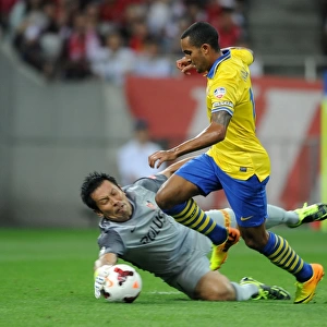 Theo Walcott vs. Norihiro Yamagishi: A Clash in the 2013-14 Urawa Red Diamonds vs. Arsenal Match