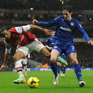 Theo Walcott vs. Peter Whittingham: Intense Battle at the Emirates - Arsenal v Cardiff City, Premier League Theo Walcott vs. Peter Whittingham: Intense Battle at the Emirates - Arsenal v Cardiff City, Premier League