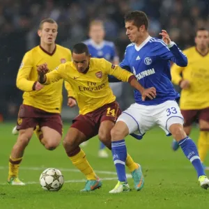 Theo Walcott vs. Roman Neustadter: A Battle in the UEFA Champions League between Schalke 04 and Arsenal FC Theo Walcott vs. Roman Neustadter: A Battle in the UEFA Champions League between Schalke 04 and Arsenal FC