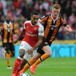 Theo Walcott vs. Sam Clucas: A Premier League Battle at KCOM Stadium