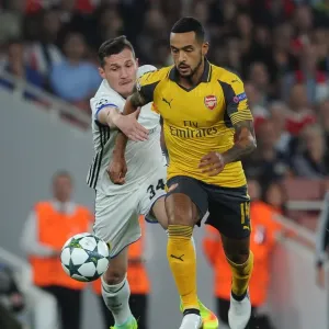 Theo Walcott vs. Taulant Xhaka: A Battle in the Arsenal FC vs. FC Basel UEFA Champions League Clash Theo Walcott vs. Taulant Xhaka: A Battle in the Arsenal FC vs. FC Basel UEFA Champions League Clash