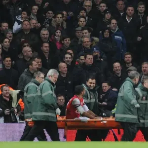 Theo Walcott's Injury Sparks Controversial Abuse from Tottenham Fans during Arsenal v Tottenham FA Cup Match Theo Walcott's Injury Sparks Controversial Abuse from Tottenham Fans during Arsenal v Tottenham FA Cup Match