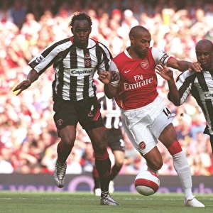 Thierry Henry (Arsenal) Claude Davis and David Sommeil (Sheff Utd)
