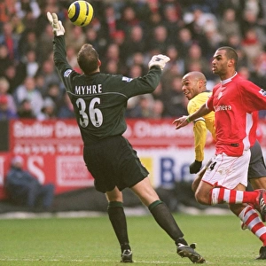 Thierry Henry (Arsenal) Thomas Myhre and Jonathan Fortune (Charlton)