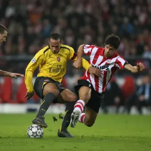Thierry Henry (Arsenal) Timmy Simons and Manuel Da Costa (PSV) Thierry Henry (Arsenal) Timmy Simons and Manuel Da Costa (PSV)