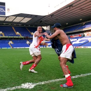 Thierry Henry and Ashley Cole celebrate at the end of the match