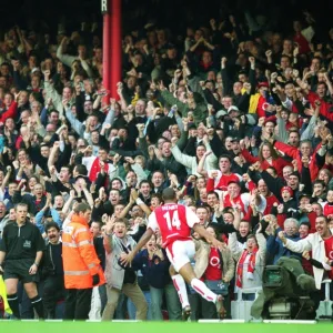 Thierry Henry breaks through the Tottenham defence on his way to scoring the 1st Arsenal goal