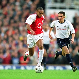 Thierry Henry breaks through the Tottenham defence on his way to scoring the 1st Arsenal goal