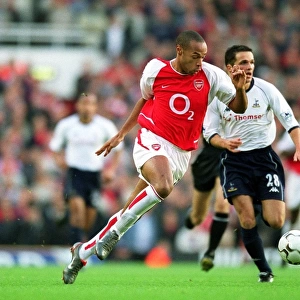 Thierry Henry breaks through the Tottenham defence on his way to scoring the 1st Arsenal goal