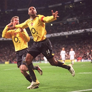 Thierry Henry celebrates scoring Arsenals goal with Alex Hleb