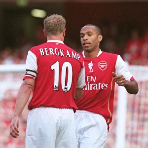 Thierry Henry celebrates scoring with Dennis Bergkamp