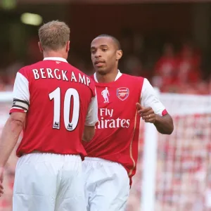 Thierry Henry celebrates scoring with Dennis Bergkamp