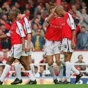 Thierry Henry is congratulated by Ray Parlour on scoring his 2nd Arsenal goal