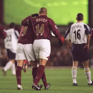 Thierry Henry congratulates Jose Reyes on the pass that set up Dennis Bergkamps goal