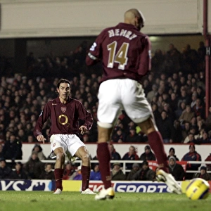 Thierry Henry delfects a shot by Robert Pires into the goal for Arsenals 1st goal