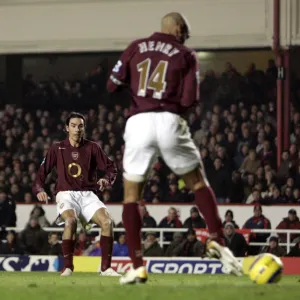 Thierry Henry delfects a shot by Robert Pires into the goal for Arsenals 1st goal