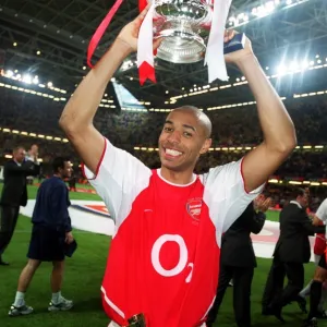 Thierry Henry with the FA Cup after the match