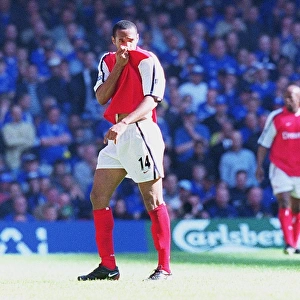 Thierry Henry kisses the Arsenal badge as he is substituted in the last seconds of the match