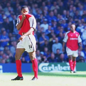 Thierry Henry kisses the Arsenal badge as he is substituted in the last seconds of the match