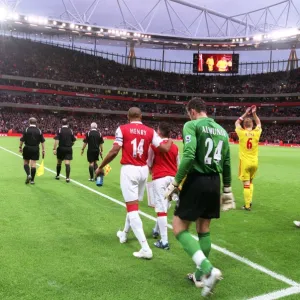 Thierry Henry and Manuel Almunia (Arsenal) walk out onto the pitch