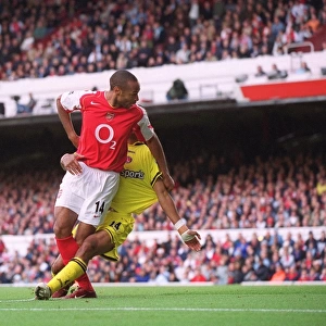 Thierry Henry scores his 1st goal, Arsenals 2nd, under pressure from Jonathan Fortune