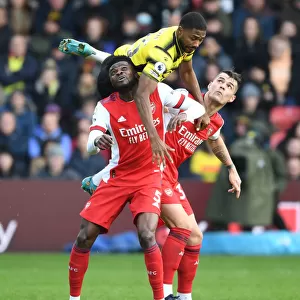 Thomas Partey and Granit Xhaka Clash with Emmanuel Dennis in Intense Watford vs. Arsenal Premier League Encounter