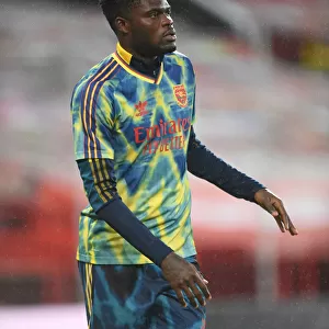 Thomas Partey's Focused Pre-Match Routine: Arsenal Star Readies for Manchester United Showdown at Empty Old Trafford (2020-21 Premier League)