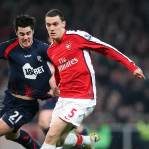 Thomas Vermaelen holds off Tamir Cohen in this Arsenal print