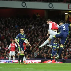 Thomas Vermaelen Leaps Past Antolin Alcaraz to Score for Arsenal Against Wigan Athletic, April 2012