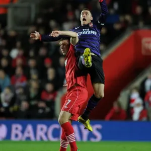 Thomas Vermaelen Leaps Above Rickie Lambert: Southampton vs. Arsenal, Premier League 2012-13 Thomas Vermaelen Leaps Above Rickie Lambert: Southampton vs. Arsenal, Premier League 2012-13
