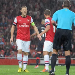 Thomas Vermaelen's Controversial Moment: Arsenal's 3-1 Victory over Olympiacos in the UEFA Champions League, Group B (2012)