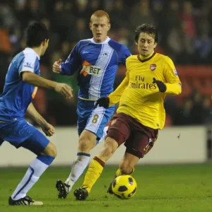 Tomas Rosicky (Arsenal) Antonlin Alcaraz and Ben Watson (Wigan). Wigan Athletic 2