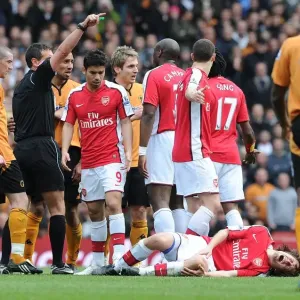 Tomas Rosicky (Arsenal) injured after a challenge from Wolves captain Carl Henry
