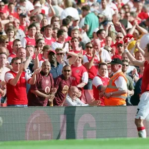 Tomas Rosicky (Arsenal) throws his shirt to the fans after the match