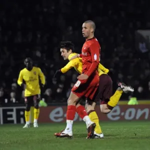 Tomas Rosicky scores Arsenals goal under pressure from Jimmy Smith (Orient) Tomas Rosicky scores Arsenals goal under pressure from Jimmy Smith (Orient)