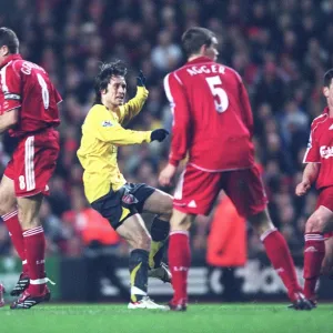 Tomas Rosicky shoots past Liverpool goalkeeper Jerzy Dudek score the 2nd Arsenal goal